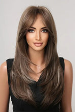 Long layered synthetic brown wig with blonde highlights and bangs