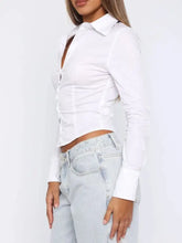 White long sleeve button-down shirt with fitted cropped silhouette and subtle vertical seam detailing