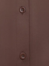 Brown button with four holes on matching brown fabric of long sleeve button front bodysuit with striped collar