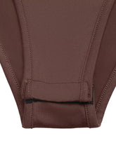 Brown ribbed long sleeve button front bodysuit with neat stitching and a small black tag at the hem