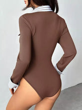 Brown long sleeve button front bodysuit with white and black striped collar and sleeve button cuffs