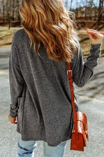 Charcoal gray oversized long sleeve cardigan with relaxed fit and pockets