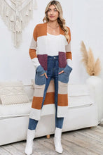 Long sleeve color block cardigan with multicolored stripes and white boots