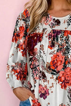 Long sleeve floral blouse with relaxed hem width and vibrant print