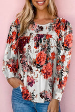 Long sleeve floral blouse with relaxed hem width and vibrant print