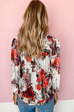 Long sleeve floral blouse with relaxed hem width