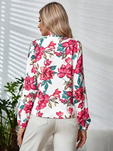 Long sleeve floral blouse with tie neck and bell sleeves