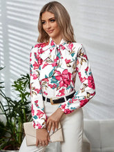 Long sleeve floral blouse with tie neck and pink flowers