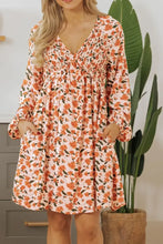 Peach floral print mini dress with bell sleeves and pockets