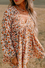 Boho floral print mini dress with bell sleeves and deep V-neck