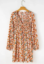 Orange floral print long sleeve v-neck mini dress in boho babydoll style
