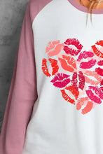 Women’s long sleeve raglan shirt with pink and white heart lip print