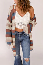 Long sleeve striped knit cardigan in brown, white, black with off-shoulder design