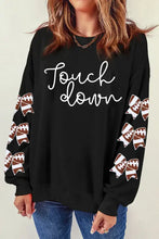 Long sleeve sweatshirt with graphic bow and touchdown football print