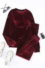 Maroon velvet long sleeve top and pants lounge set with natural waistline drawstring and ribbed sleeve length cuffs