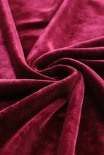 Long sleeve top and pants lounge set in rich burgundy velvet with soft plush texture and natural waistline detail