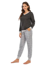 Gray and white polka dot long sleeve pajama set with v-neck top and elastic cuffs for comfortable loungewear