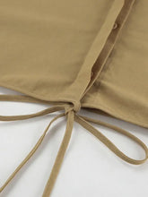 Beige cotton long sleeve blouse from top and shorts set with buttoned front and tie details