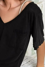Loose fit black V-neck T-shirt with chest pocket in knit slub fabric