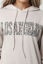 Light beige Los Angeles graphic hoodie with leopard print text
