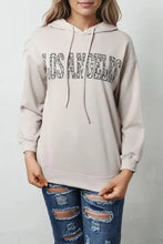 Los Angeles graphic hoodie in beige with leopard print text and long sleeve length