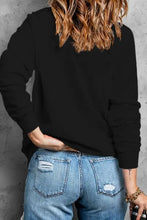 Love rhinestone clover round neck sweatshirt with black top and jeans