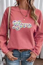 Women’s long-sleeve pink corduroy sweatshirt with colorful day love graphic