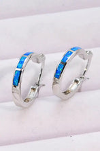 Silver-toned sterling silver hoop earrings with blue opal inlays in matching box