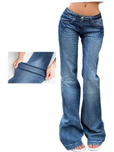 Low rise flare jeans in blue denim with classic wash and subtle fading for a stylish casual look