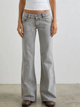 Gray low rise flare leg denim jeans with faded wash and classic five-pocket design in wide-leg style