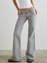 Light-wash low rise flare leg jeans with classic five-pocket design and subtle fading along the thighs