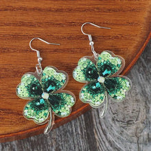 Lucky clover acrylic dangle earrings with shiny green four-leaf clovers and gemstones