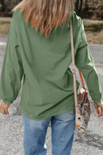 Olive green hooded sweatshirt with sequin lucky clover lace back detailing