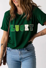 Woman in Lucky Round Neck Short Sleeve T-Shirt and jeans