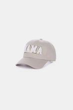 Light brown MAMA chenille patch baseball cap with white city-themed embroidery
