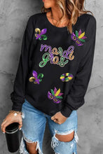 Mardi Gras sequin round neck sweatshirt with black sequins and blue jeans