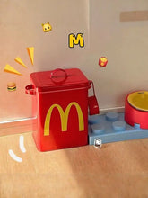 Red McDonalds style pet food storage box with yellow M logo