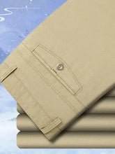 Stack of mens basic style pocketed pants in beige