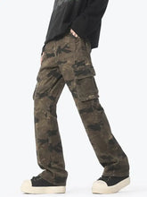 Men’s camouflage cargo jeans with faded olive green and dark brown camouflage print featuring multiple large pockets