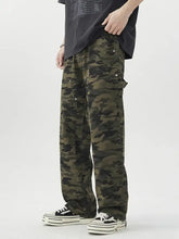 Men’s loose fit jeans in olive green and black camouflage with reinforced stitching and multiple cargo pockets