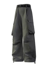 Mens cargo wide leg pants in dark gray with black belt and ankle cinch cords