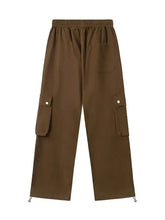 Mens casual cargo drawstring pants in brown with side pockets and cinched ankles