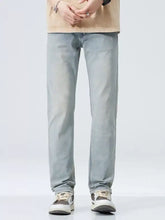 Men’s classic straight fit jeans in light-wash denim with a straight fit and subtle fading for everyday wear