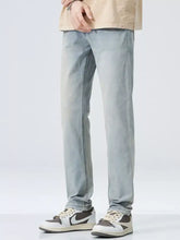 Men’s classic straight fit jeans in light-wash denim with straight fit and subtle fading on the thighs
