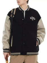 Men’s contrast snap down jacket in black and beige with white embroidered text on the left chest