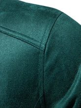 Close-up of dark green suede biker jacket shoulder stitching