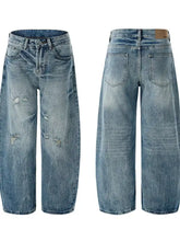Men’s distressed loose fit light-wash denim jeans with wide-leg cut and subtle fading in a loose fit design