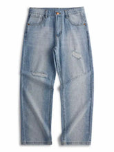 Light-wash denim men’s distressed relaxed fit jeans with intentional distressing and frayed patches