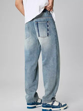 Men’s distressed relaxed fit jeans in light-wash denim with a wide-leg cut and subtle fading