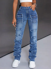 Men’s distressed slim fit blue denim jeans with ripped patches and ruched cuffs in a casual style